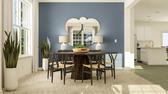 dining room featuring light hardwood / wood-style floors and plenty of natural light