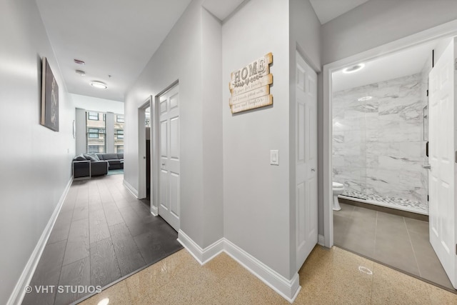 hallway with dark wood-type flooring