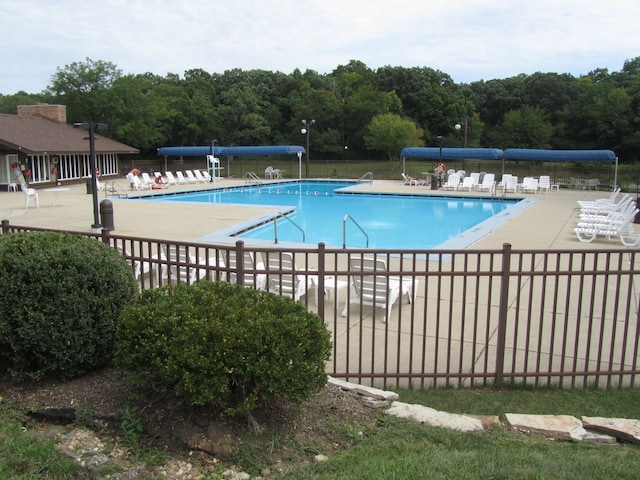 view of swimming pool featuring a patio area