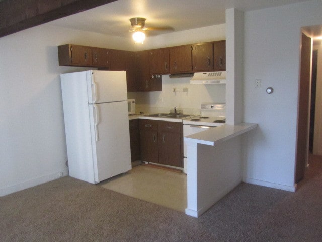 kitchen featuring light carpet, ceiling fan, and white appliances