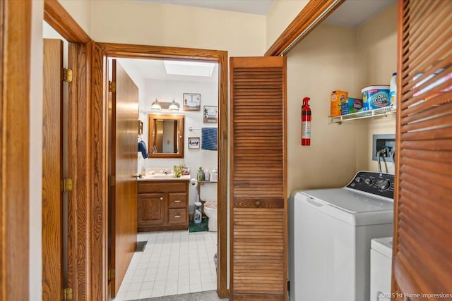 laundry area featuring washer and dryer and sink