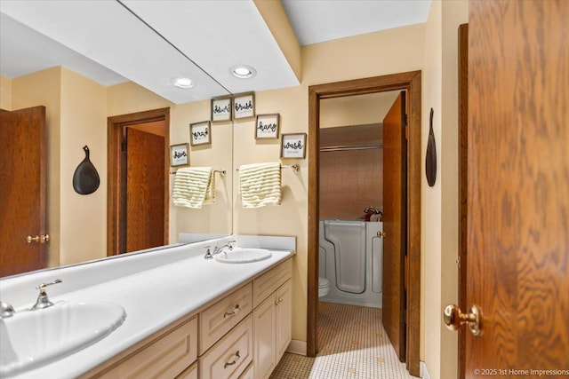 bathroom with vanity and tile patterned floors