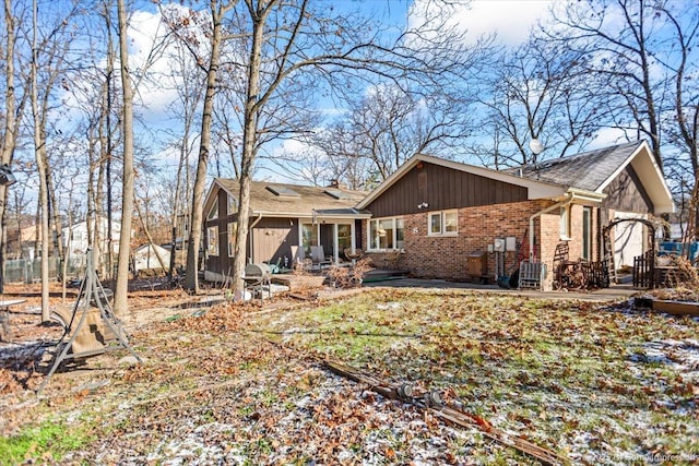 rear view of property featuring a patio area