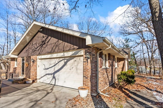 view of side of property with a garage