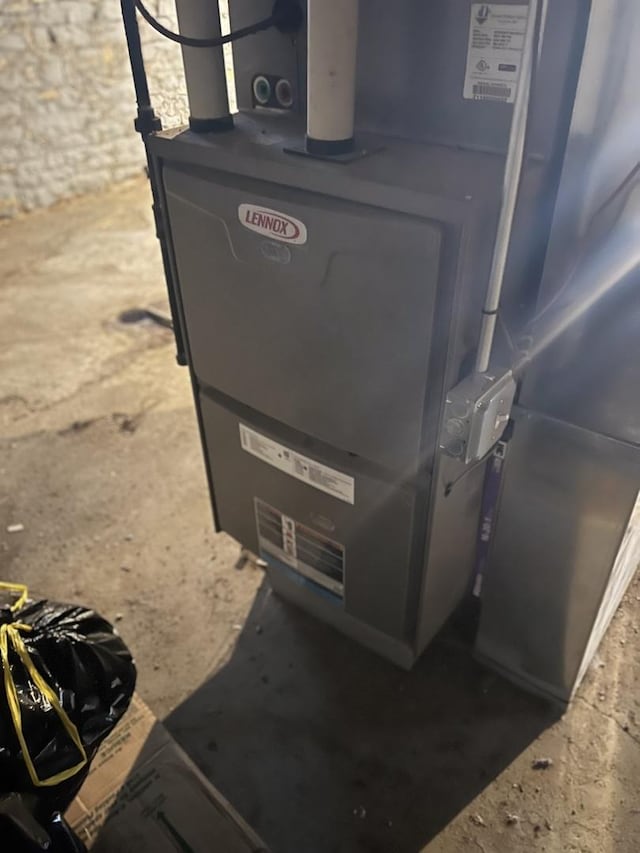 utility room with heating unit