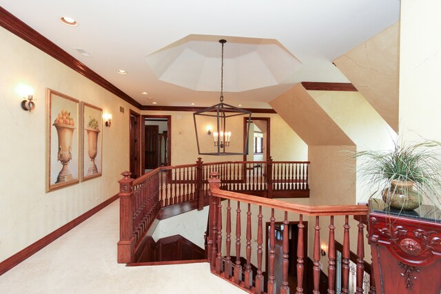 interior space with crown molding, carpet, and a notable chandelier