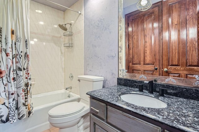 full bathroom with vanity, toilet, and shower / tub combo