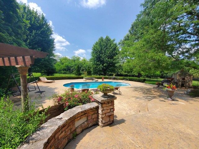 view of pool featuring a patio