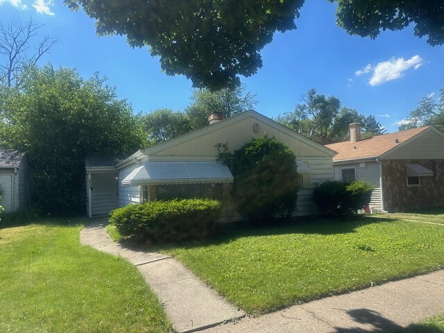 view of home's exterior with a lawn