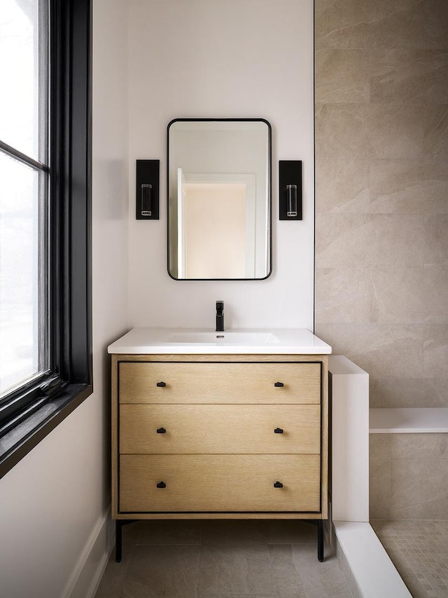 bathroom featuring tile patterned floors and vanity