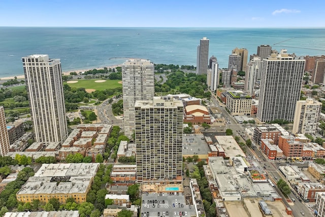 drone / aerial view featuring a view of city and a water view