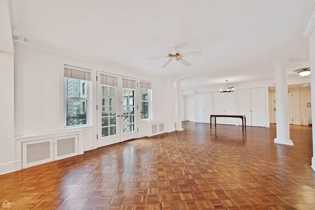 1755 E 55th St Unit 804, Chicago, IL 60615 - unfurnished living room featuring decorative columns, ceiling fan, a chandelier, ornamental molding, and french doors