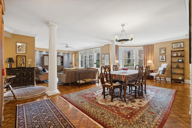 dining area featuring ceiling fan, dark parquet flooring, and crown molding