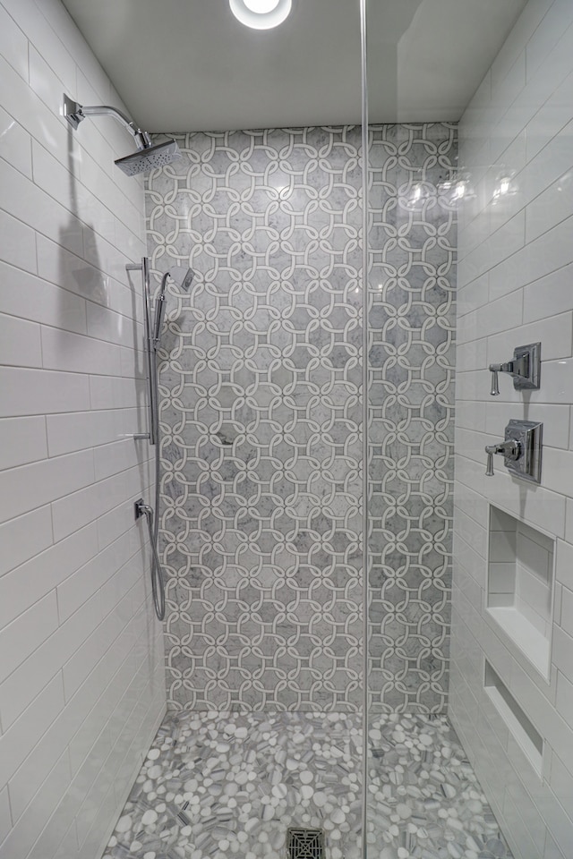 bathroom with a tile shower