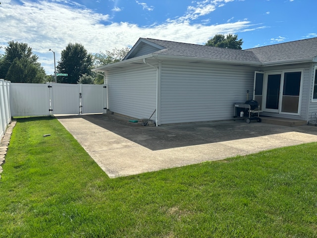 view of home's exterior featuring a patio and a lawn