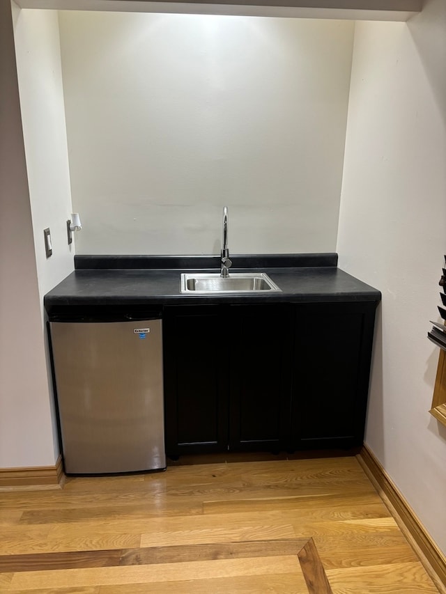 bathroom featuring sink and wood-type flooring