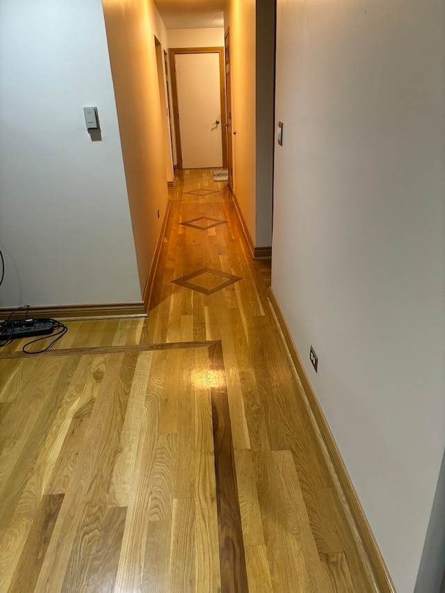 hallway featuring light hardwood / wood-style flooring