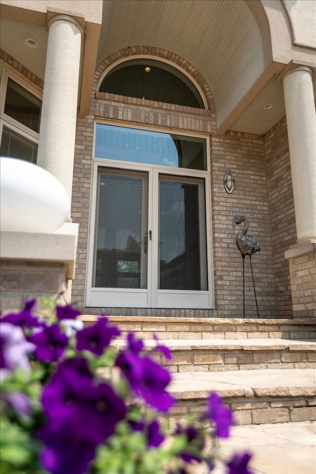 view of exterior entry featuring french doors