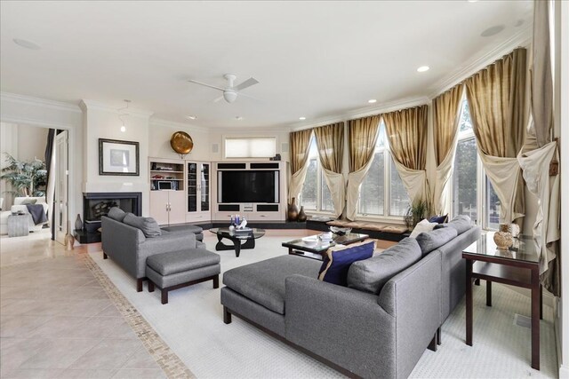 tiled living room featuring crown molding, built in shelves, and ceiling fan