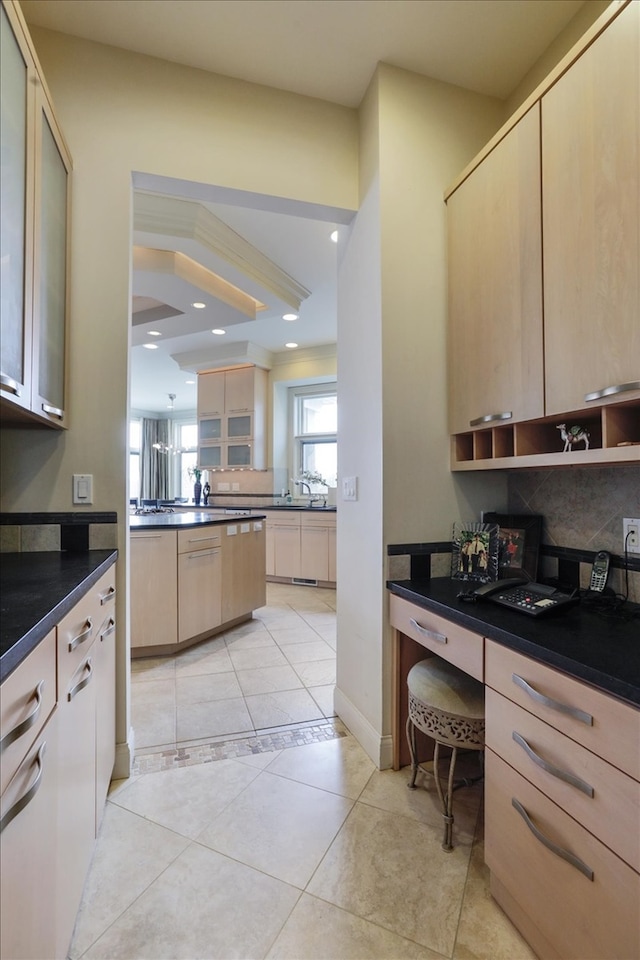 kitchen featuring light tile patterned flooring, tasteful backsplash, and light brown cabinetry