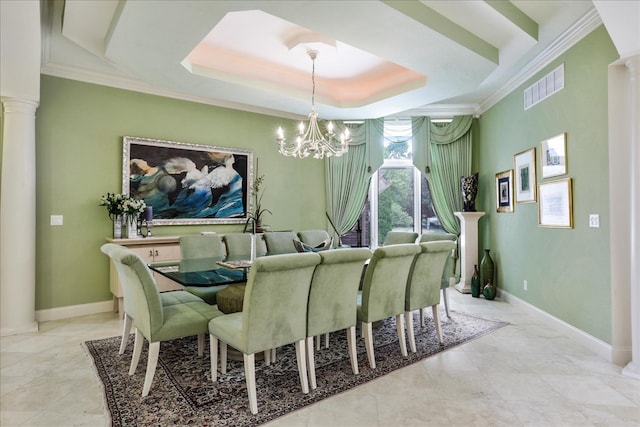 tiled dining space featuring a chandelier, crown molding, decorative columns, and a tray ceiling