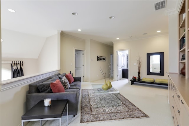 carpeted living room with ornamental molding