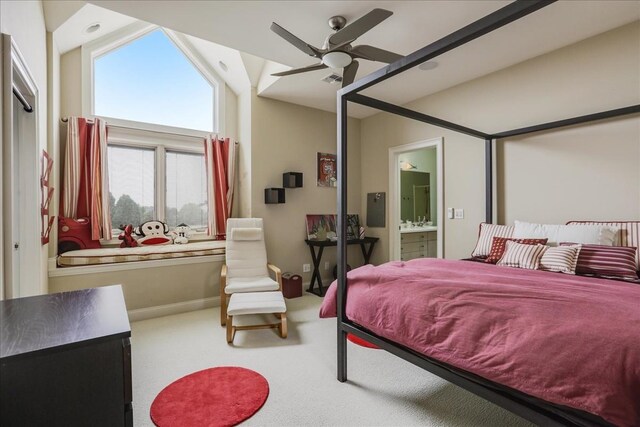 carpeted bedroom featuring ensuite bathroom and ceiling fan