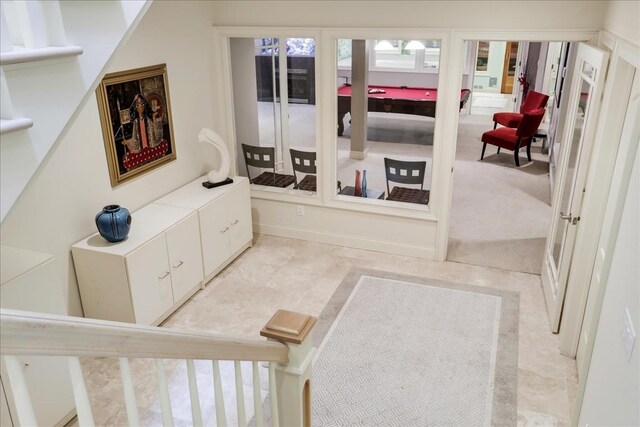 interior space featuring light colored carpet and billiards