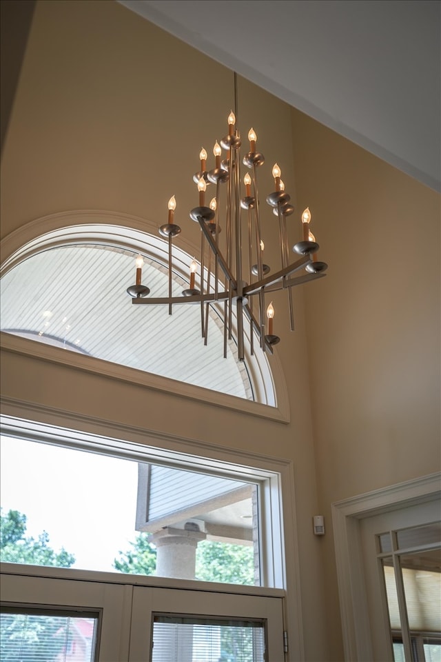 interior details featuring a chandelier