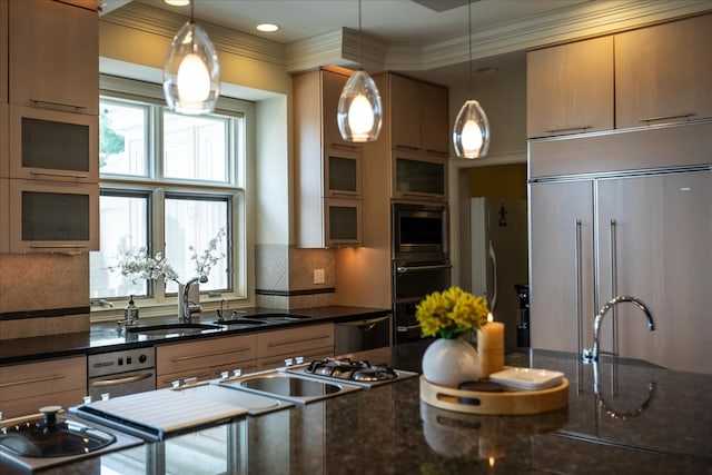 kitchen with decorative light fixtures, ornamental molding, sink, appliances with stainless steel finishes, and backsplash