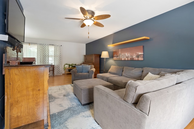 living room featuring hardwood / wood-style flooring and ceiling fan