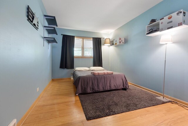 bedroom with light hardwood / wood-style flooring