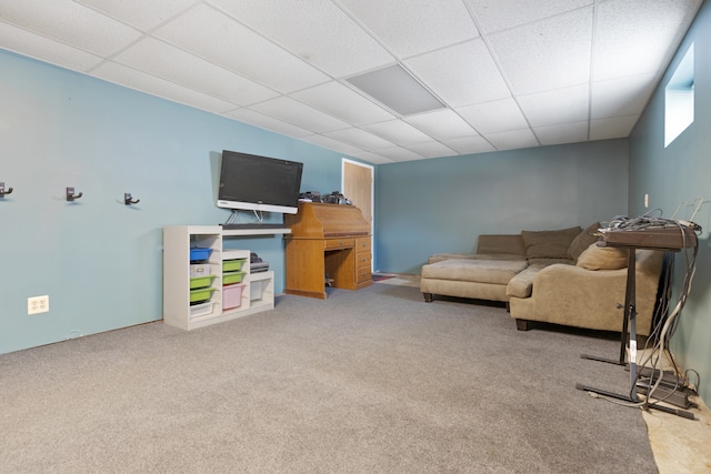 carpeted living room with a paneled ceiling