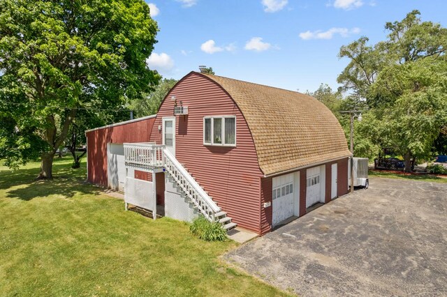 garage with a lawn