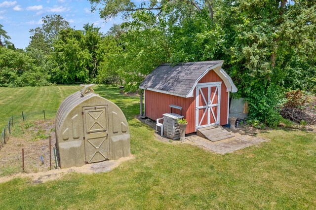 view of outdoor structure with a lawn