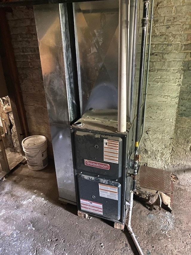 utility room with heating unit