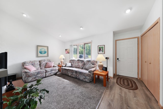 living room with hardwood / wood-style flooring and lofted ceiling