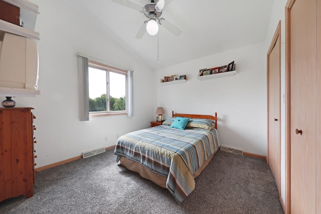 bedroom featuring dark colored carpet, ceiling fan, and lofted ceiling