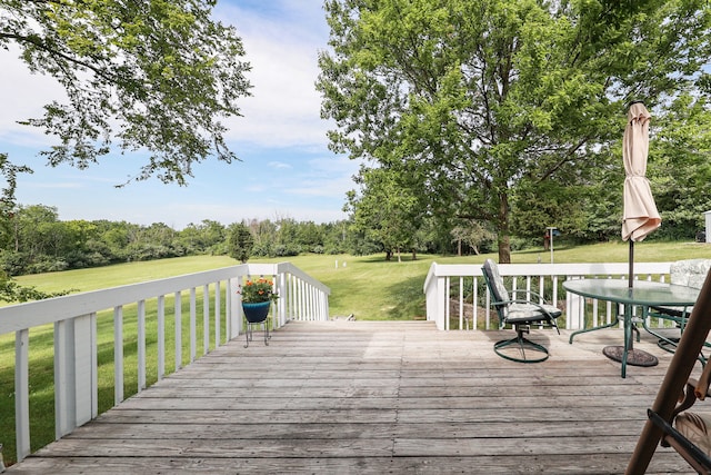 view of dock with a yard and a wooden deck