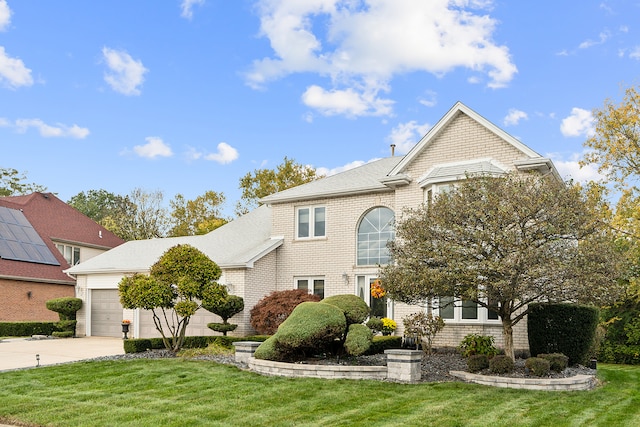 view of property with a front lawn and a garage