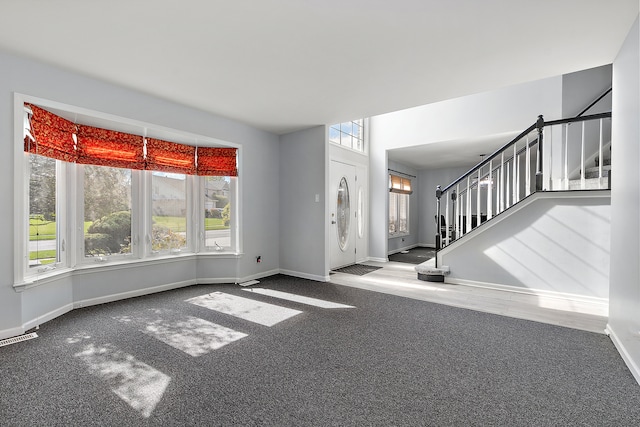 view of carpeted entrance foyer