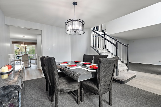 dining room featuring an inviting chandelier and hardwood / wood-style floors