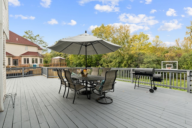 wooden deck featuring area for grilling