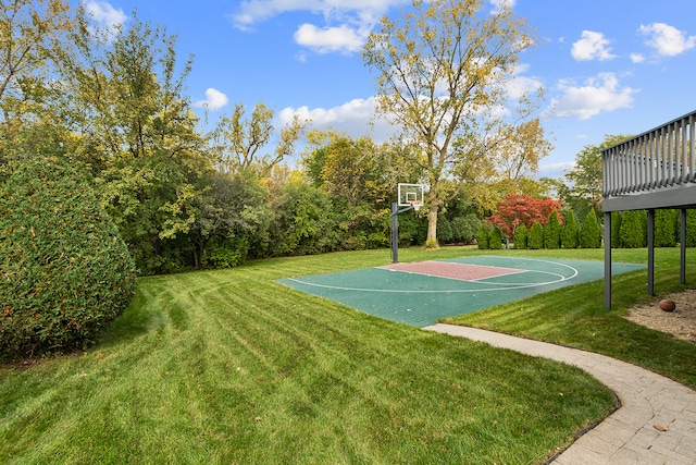 view of basketball court featuring a lawn