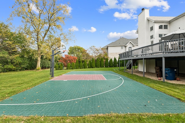 view of basketball court featuring a lawn