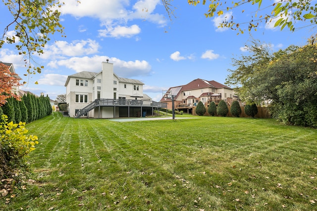 view of yard with a wooden deck