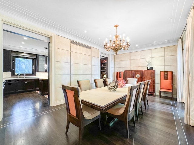 dining space with crown molding, dark wood finished floors, recessed lighting, a notable chandelier, and tile walls