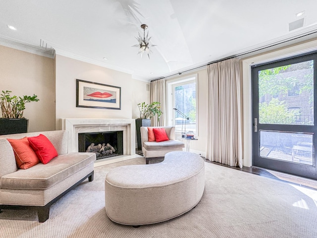 living area with a fireplace and crown molding