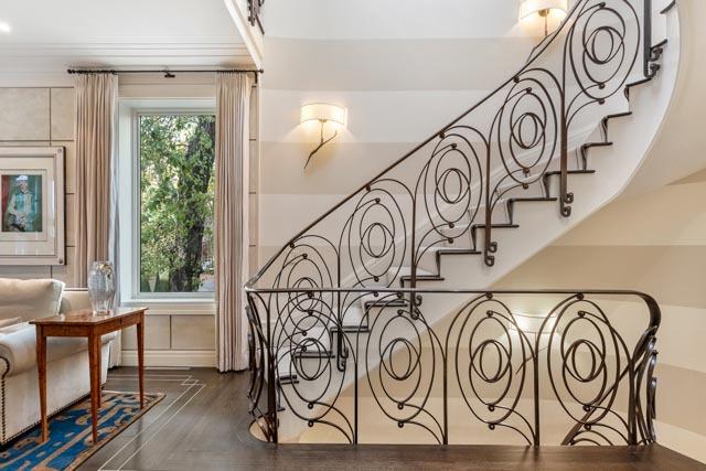 stairway featuring baseboards and wood finished floors