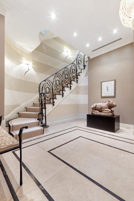 staircase featuring recessed lighting, visible vents, and baseboards